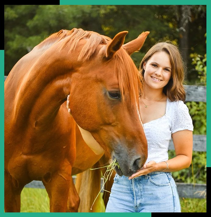 An equine professional with a chestnut horse